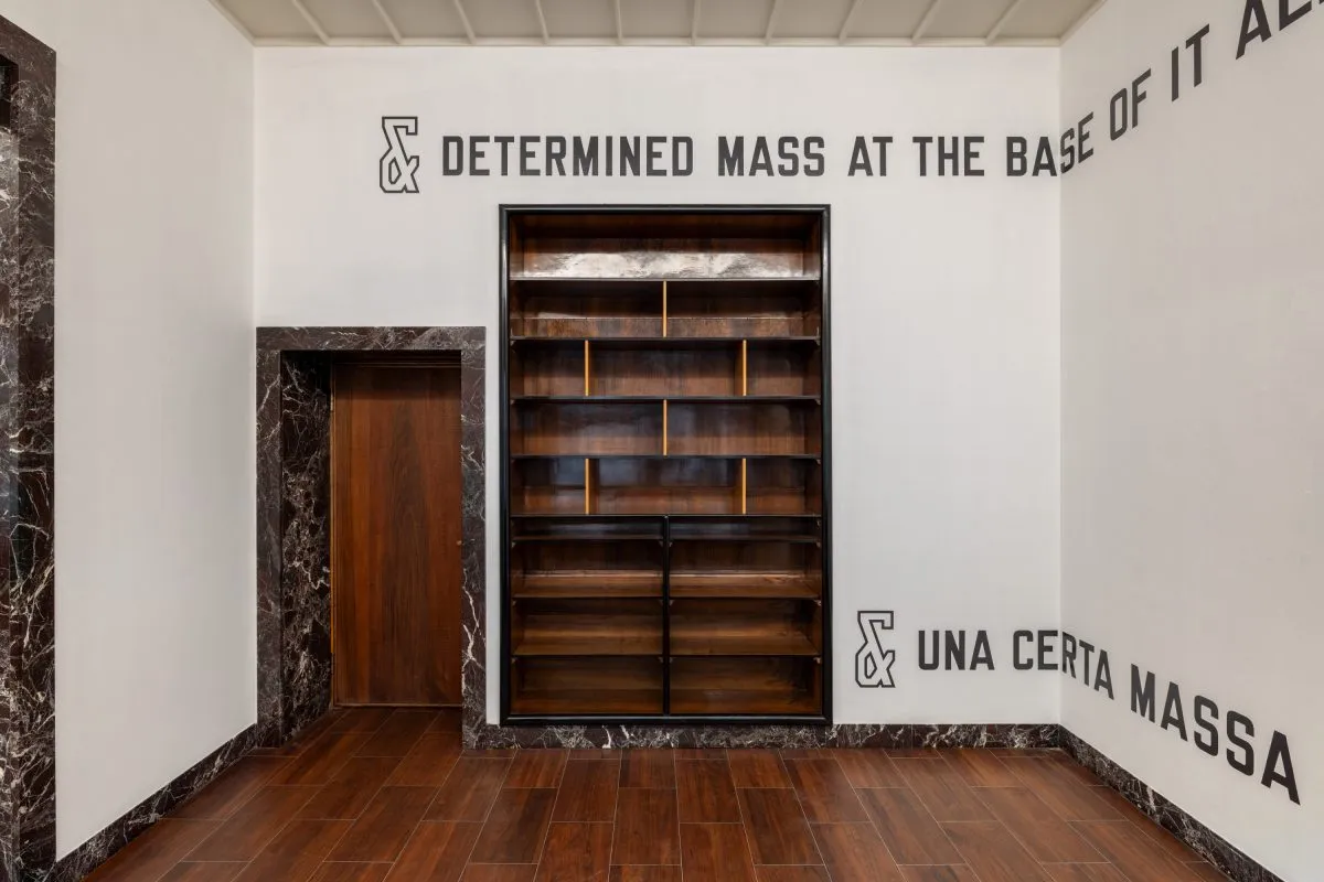 Installation view of Lawrence Weiner: & Una certa massa alla base di tutto | & Determined mass at the base of it all